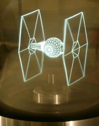 O novo sistema holográfico presentando un TIE Fighter en 3D